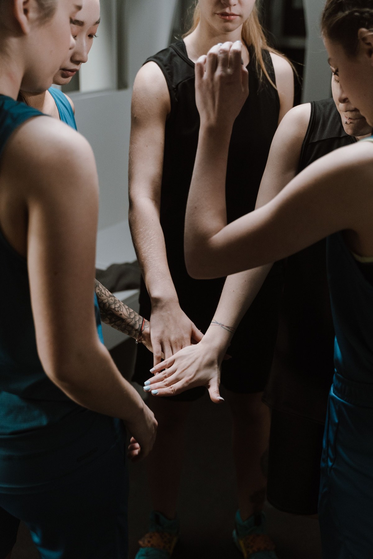 Fitness studio team huddling together before a class